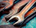 Old spanners. Grunge background of instruments. Keys close-up. Vintage turquoise and red Royalty Free Stock Photo