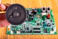 Old speaker removed from the radio. Electronics from old electronic devices Royalty Free Stock Photo