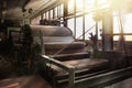 Interior of an old abandoned factory in the morning sun Royalty Free Stock Photo