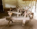 Old spinning wheels in spanish mission Royalty Free Stock Photo
