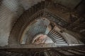 Old spiral staircase at the old abandoned building, top view Royalty Free Stock Photo