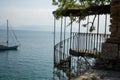 Old outdoor spiral staircase heading down to the beach in corfu, greece Royalty Free Stock Photo