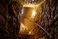Old spiral staircase inside red brick tower. Turaida Castle tower