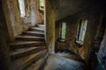 Old spiral staircase in tower of abandoned mansion Royalty Free Stock Photo