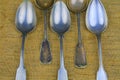 Old spoons on a bagging background. Five vintage spoons. Top view. Free space for text. Royalty Free Stock Photo