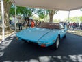 Old sport sky blue 1979 De Tomaso Pantera in a park. Autoclasica 2022 classic car show. Royalty Free Stock Photo