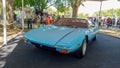 Old sport sky blue 1979 De Tomaso Pantera in a park. Nature, tre Royalty Free Stock Photo