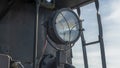 The old spotlight of the Soviet locomotive of the early 20th century. Retro light in front part of train. Royalty Free Stock Photo