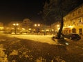 Old square in historical Bielsko-Biala city center in Poland with old buildings, street lamps at evening