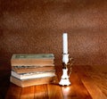 Old stack of books with candlestick Royalty Free Stock Photo