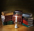 Old stack of books with candlestick Royalty Free Stock Photo