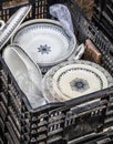 Old stack of white and blue plates at flea market