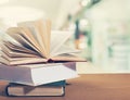 Old stacked books on wooden table