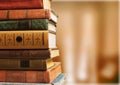 Old stacked books on blurred background Royalty Free Stock Photo