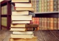 Old stacked books on blurred background Royalty Free Stock Photo