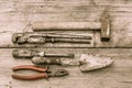 Old stained hammer, adjustable wrench, screwdriver, trowel and p Royalty Free Stock Photo