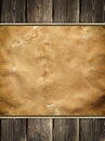 Old stained paper sheet on wooden background Royalty Free Stock Photo