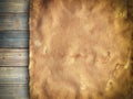 Old stained paper sheet on wooden background Royalty Free Stock Photo