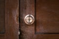 Old stainless door knob or handle on grunge wooden door, grunge wooden door with lock Royalty Free Stock Photo