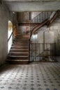 Old staircase in an abandoned hall Royalty Free Stock Photo