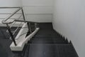 Old staircase with a handrail in a building., in the office