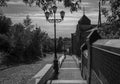 old staircase leading to the city and street lamp