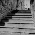 An old staircase among the narrow streets in the medieval town of Massa Marittima in Tuscany shot with analogue film technique Royalty Free Stock Photo