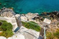 Old stairs from the beach leading to clear azure water Royalty Free Stock Photo