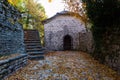 Old stairs in park covered with yellow maple leaves. Autumn concept Royalty Free Stock Photo