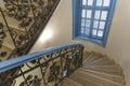 Old stairs with window painted in blue colour