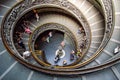 The old stairway inside the Vatican museum with moving people in Rome, Italy. Bramante Staircase. Royalty Free Stock Photo