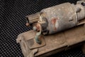 Old starter with damaged solenoid removed from automobile. Royalty Free Stock Photo