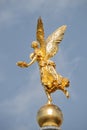 Old statue of a golden angel as a warrior and defender at the dome top of the central historical building of Albertinum museum in Royalty Free Stock Photo