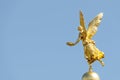 Old statue of a golden angel as a warrior and defender at the dome top of the central historical building of Albertinum museum in Royalty Free Stock Photo