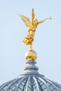 Old statue of a golden angel as a warrior and defender at the dome top of the central historical building Zitronenpresse in Royalty Free Stock Photo