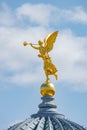 Old statue of a golden angel as a warrior and defender at the dome top of the central historical building Zitronenpresse in Royalty Free Stock Photo