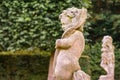 Stone angel statue in garden. Guardian angel statue in sunlight as a symbol of love in garden. Royalty Free Stock Photo
