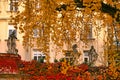 old statues and colorful autumn foliage in park Vienna