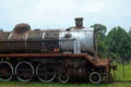 OLD STEAM LOCOMOTIVE AT AN ABANDONED STATION Royalty Free Stock Photo