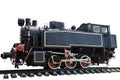 An old steam locomotive without carriages stands on the rails on a clean white background with clipping. Photographed from the Royalty Free Stock Photo