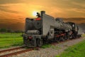 The old steam locomotive,golden sunset scenic cloudscape.