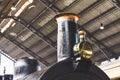 Old steam locomotive inside an old train station. Royalty Free Stock Photo