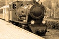 Old steam locomotive. Old vintage steam-powered train rides on rails Royalty Free Stock Photo