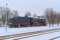 Old steam locomotive in the snow in Tapa station