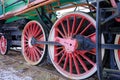 Old steam locomotive wheel and connecting rods. Tie rod or side rod for drive wheels. A retro specimen Royalty Free Stock Photo