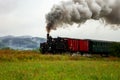 Old steam machine in highland landscape Royalty Free Stock Photo