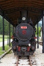 Old steam powered locomotive. Vintage steam train locomotive.