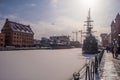 Old steamer and a sailship mooring in winter time in GdaÃâsk