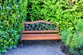 Old steel chair and wood in a garden.