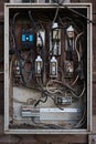 Old electric breaker box with wires and fuses Royalty Free Stock Photo